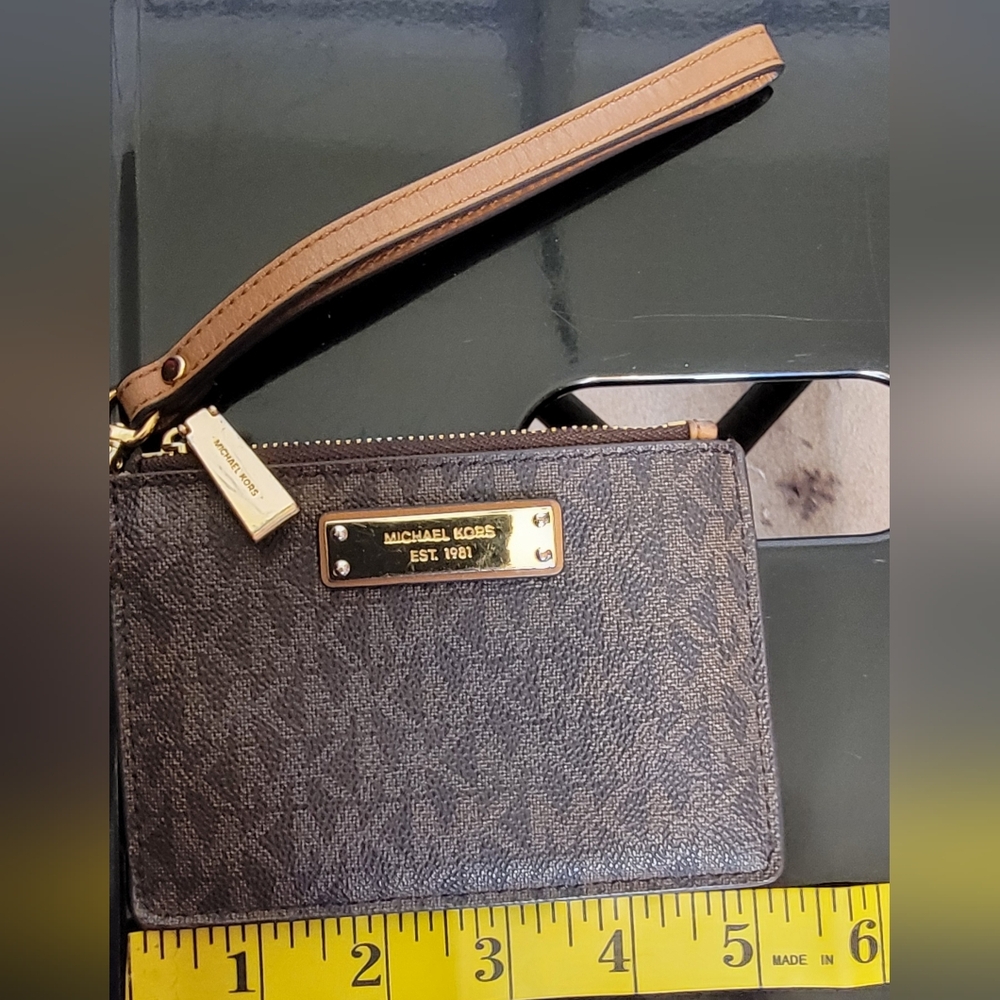 #568-Michael Kors Brown Monogrammed Wristlet